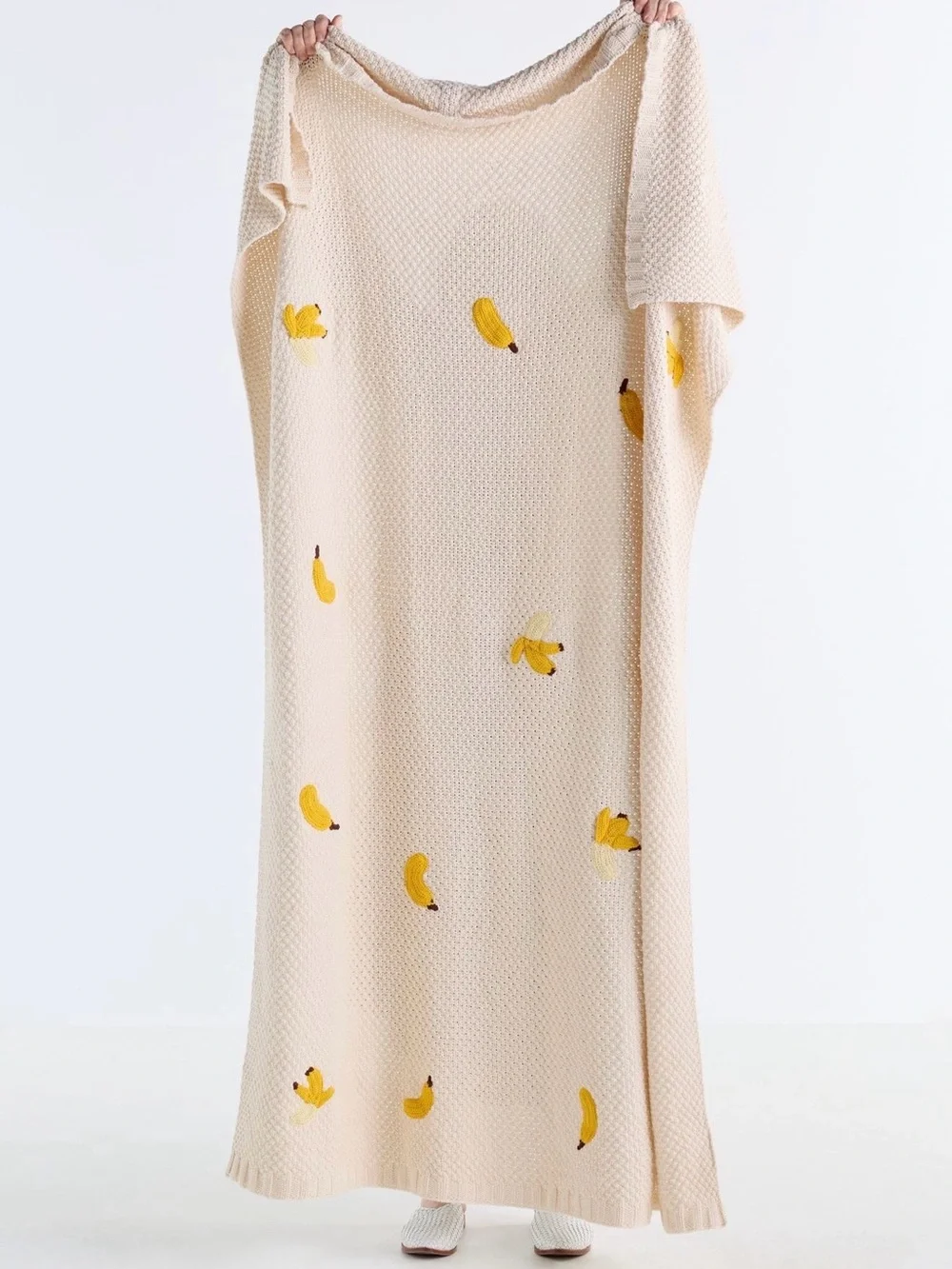 Isabella Cotton Knit Icon Banana Throw Blanket from Anthropologie